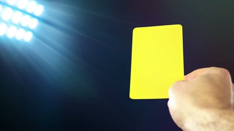 Football / soccer referee shows penalty yellow card, slow motion Video Stok