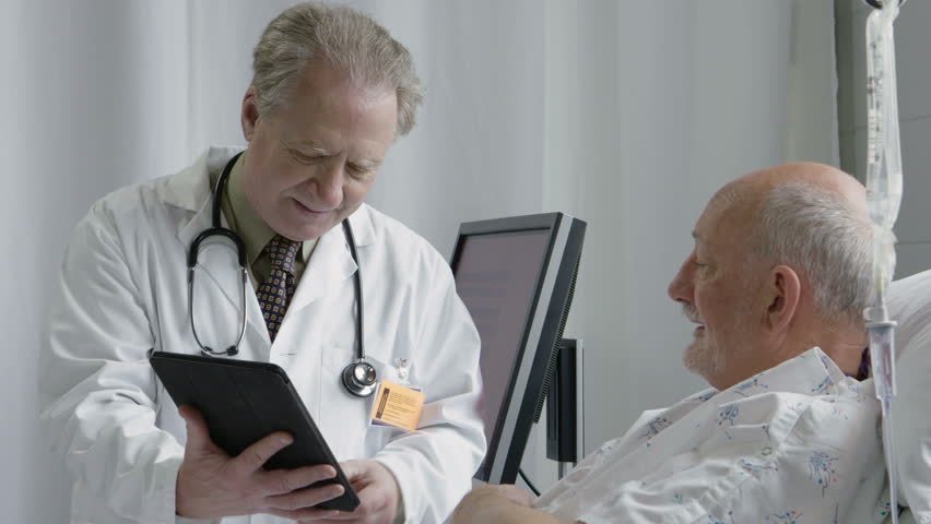 Physician with an ipad consulting with a senior male patient | Shutterstock HD Video #16184299