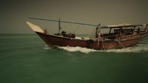 Bahrain Dhow. View from a speed boat on the Gulf Sea, of a Bahraini dhow or traditional fishing boat.