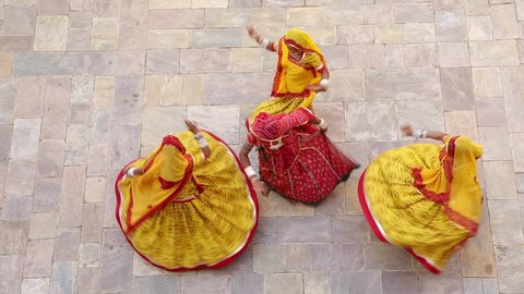 India, Rajasthan, Jaipur, Samode Palace, women wearing colourful Saris dancing - Model and Property released