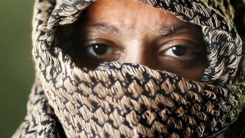 Middle Eastern woman eyes closeup wearing traditional Shemagh Arab head wrap scarf 