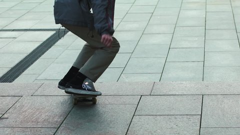 a Man Riding on a Skateboard and Jump From a Springboard Concrete Steps and a Springboard For Adventure Sports Man Rides a Skateboard, and Trying to do the Trick But Nothing Happens Slow Motion
