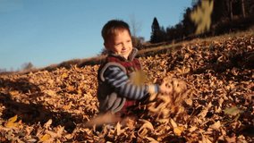 Fun with leaves by little child in autumn. Clip ID: autumn1_HD