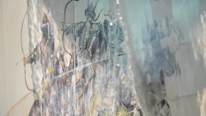 Ancient Warriors on a Fountain. They are shot trough the falling water showing that great history stays on a solid ground no matter how quickly the time passes.