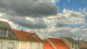 Clouds over roofs, HD time lapse clip, high dynamic range imging (hdr)