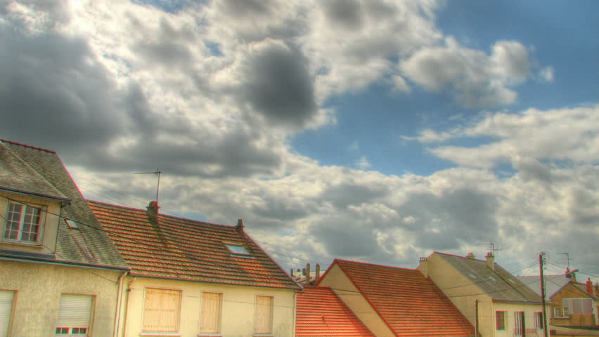 Clouds over roofs, HD time lapse clip, high dynamic range imging (hdr)