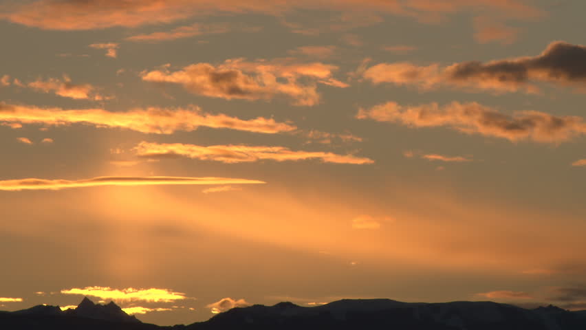 The sun rises over the Kenai Mountains