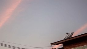 sky with satellite dish and antenna sunset 4k