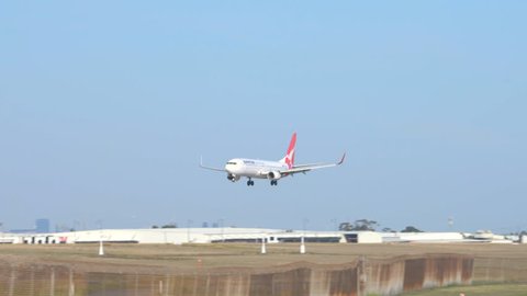 Melbourne, Australia - Apr 26, 2016: 4k video of a Qantas passenger airplane landing at Melbourne Airport
