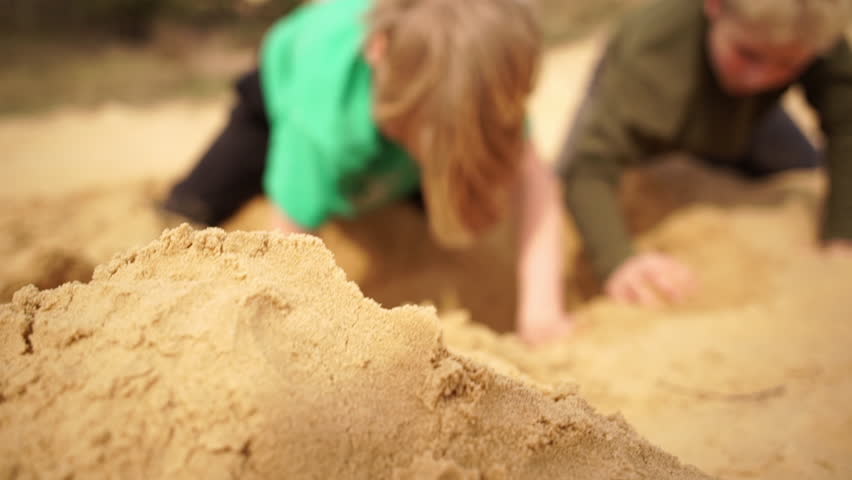 Family spending time together and having fun in Oleshky sands.Ukraine. Slow motion