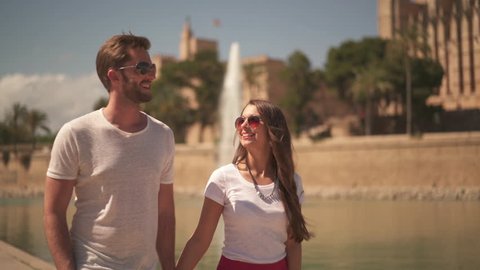 4k footage, happy young couple walking together on city sightseeing in Palma de Mallorca

