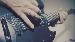 Close up of a guitarist playing electric guitar