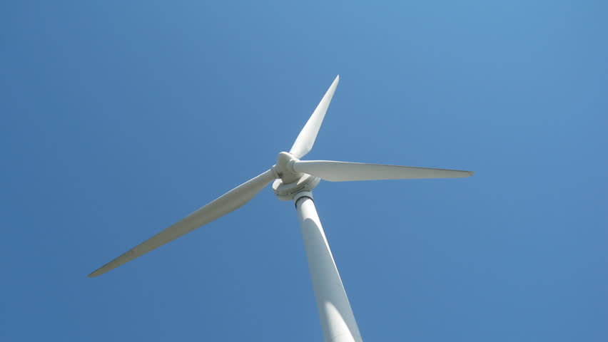 Looking up at a wind turbine generating clean, green electricity for the city of