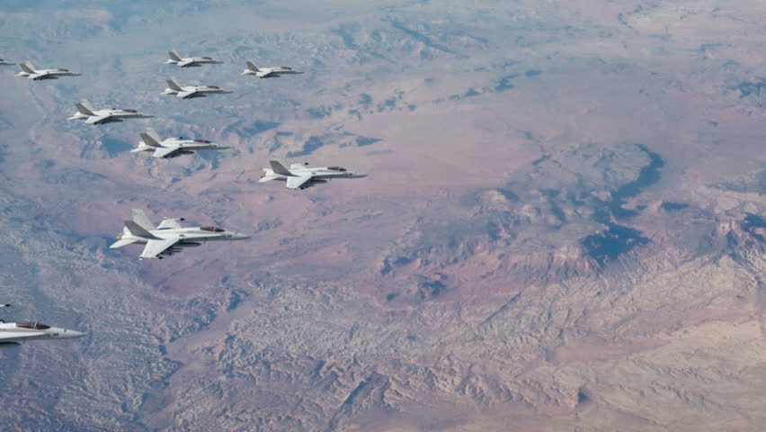 A squadron of F18 fighter jets flying in a four-finger formation ready to