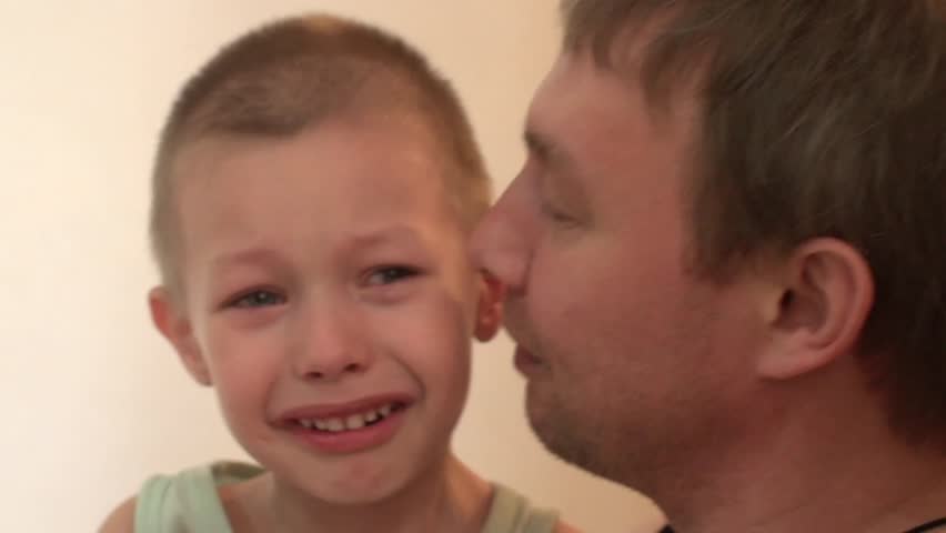 child crying, angry, and beats his father,father of the child calms Royalty-Free Stock Footage #16249975