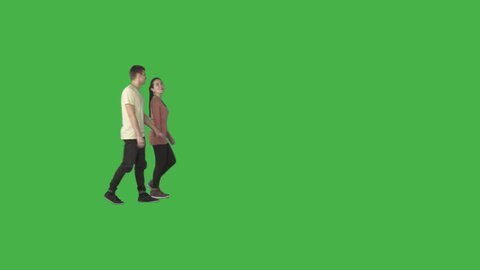 Young guy & girl go holding hands. Cut out video on transparent background. File format - .mov, codec PNG+Alpha. Shutter angle -180 (native motion blur). 50 mm lens
