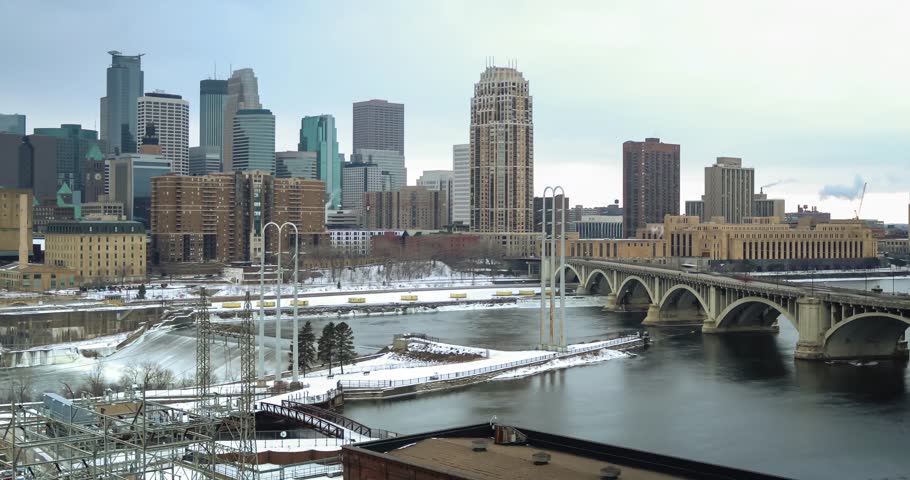 Time lapse video of Minneapolis skyline, shot from St. Anthony. Overlooking the moving river, traffic on the 3rd Ave South bridge, and various smoke stacks in the city. Size 4K (4096 x 2160).