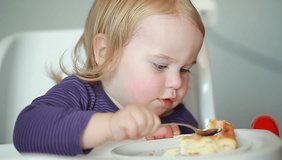 Video Baby eats porridge spoon mashed