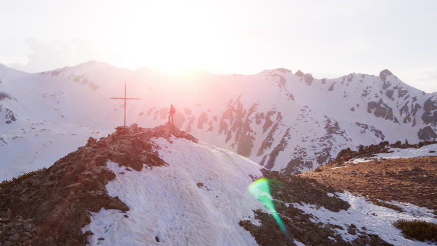 Aerial Flight At Sunset In Snowy Mountains Man Raising Arms In Worship Pose Spirituality Religion Worship Concept