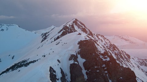 Epic Aerial Flight Over Mountain Peak Edge Range At Sunset Inspirational Winter Nature Landscape Concept