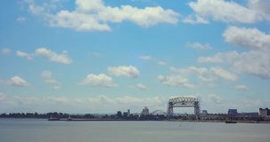 Time lapse video of Lake Superior and the Duluth Lift Bridge. Clouds roll by as the bridge moves up and down for ships on a beautiful summer day. Size 4K (4096 x 2160).