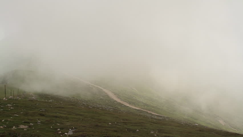 Foggy mountain ridge. Trekking path and marks can be seen. Central Balkan National Park, Stara Planina, Bulgaria.