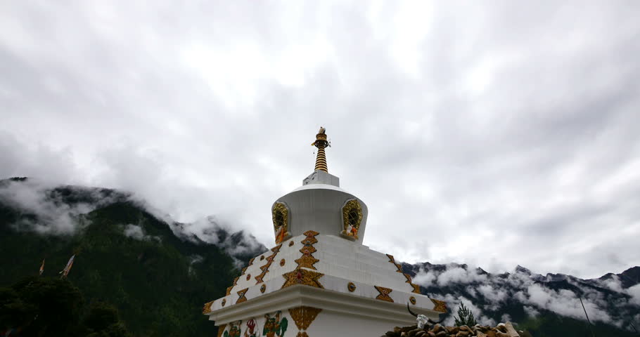 4k tibet buddhist white stupa,time lapse of clouds cover mountain. gh2_10159_4k