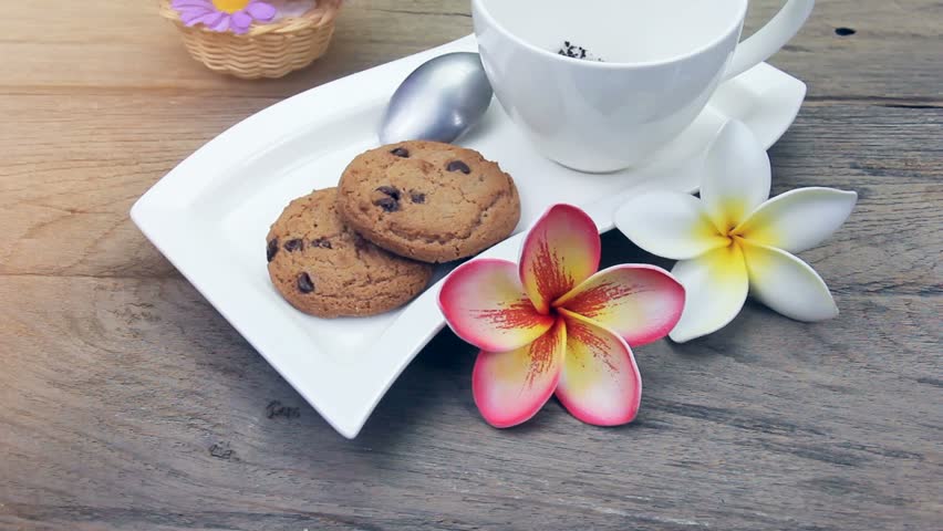 coffee in cup with chocolate chip cookies,filter effect.