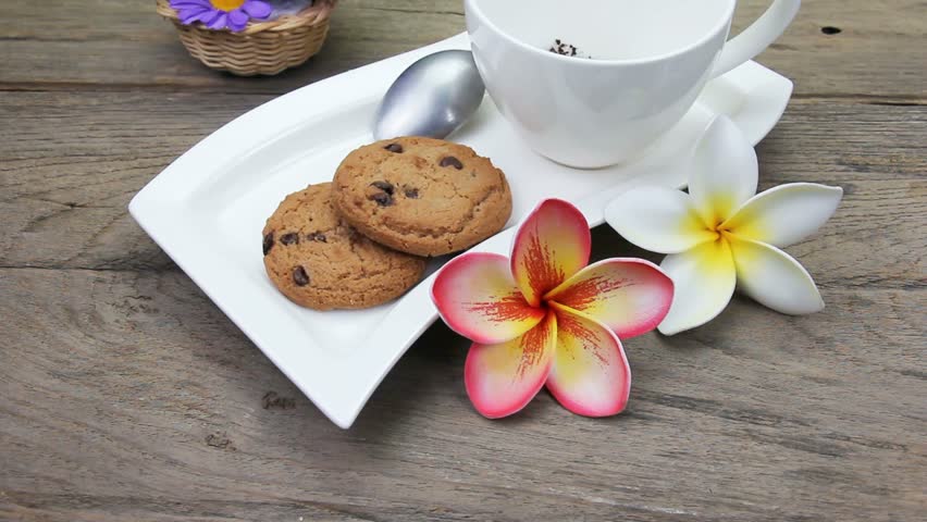 coffee in cup with chocolate chip cookies
