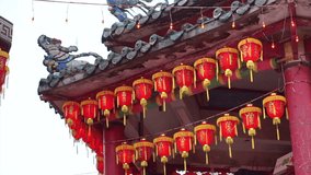HD video  Chinese red lanterns. Illuminate lamps to celebrate Chinese New Year. Beautiful night scene of temple in Taiwan China