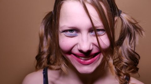 Scary teen girl looking  angry and have a sinister laugh. 4K UHD