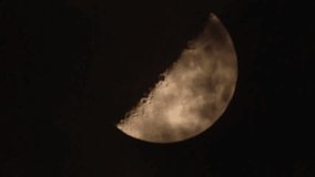 Night time sky with half moon and clouds