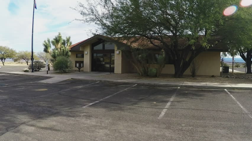 KINGMAN, AZ/USA: January 5, 2016- Arizona Game And Fish Department office in Kingman, Arizona. Slow zoom in shot of a small government wildlife hunting regulation office.