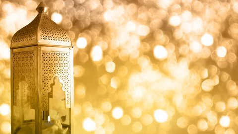 Arabic ornamental lantern with burning candle and glittering bokeh lights background, loopable Ramadan HD footage