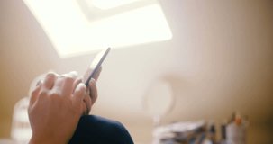 Woman at home using smartphone