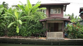 Traditional Thai house on waterside