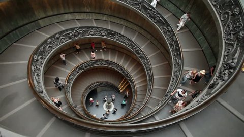 VATICAN CITY - MAY 25: Tourists leaving the Vatican Museum spiral stairs after listen to the Pope on steps of Cathedral May 25, 2011. Rome, Italy. Words of wisdom to Catholic church members.
