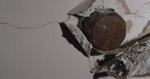 Smash through Drywall with hammer in slow motion