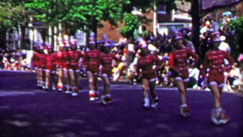 WINCHESTER, NEW YORK 1952: Marching band chorus line parade woman falls after high kick.
