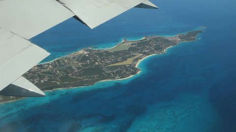 Flying over western end of the island of Anguilla in the Caribbean. Note some smudges on plane window.
