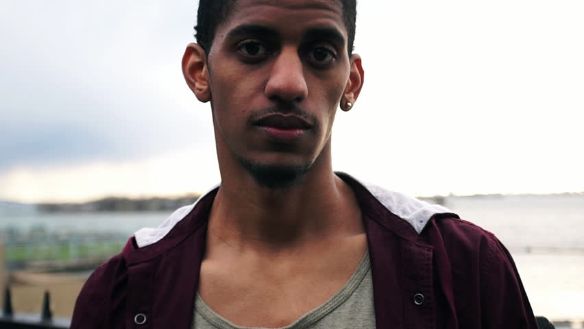 A profile of a young, black male looking into the camera. New York, NY - March, 2016