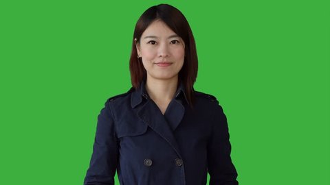 young asian women standing isolated against green screen background. portrait of chinese  female person. 