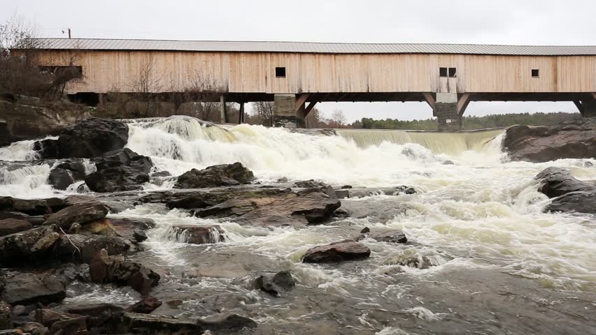 BATH, NEW HAMPSHIRE May 2nd: Ammonoosuc river flowing under the Bath covered bridge at Bath, New Hampshire on May 2nd, 2016 in Bath, Maine.