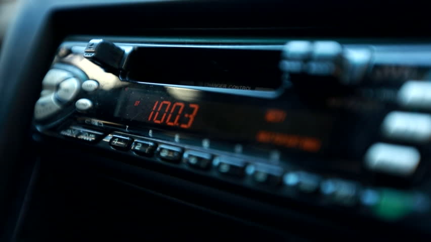 Car radio close up shakey camera.