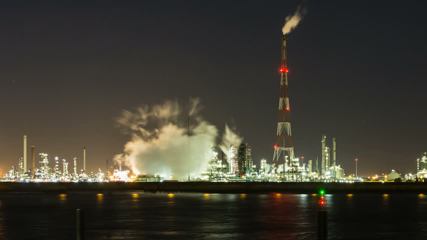 Timelapse sequence of a large oil refinery in the harbor of Antwerp, Belgium in the night.