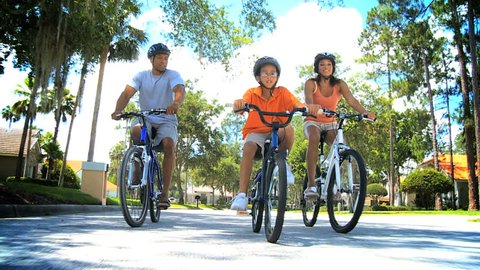 Healthy Ethnic Family Bike Riding Together Stock Video