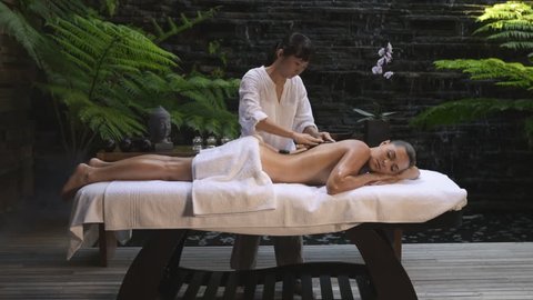 asian back massage theraphy spa hot stone