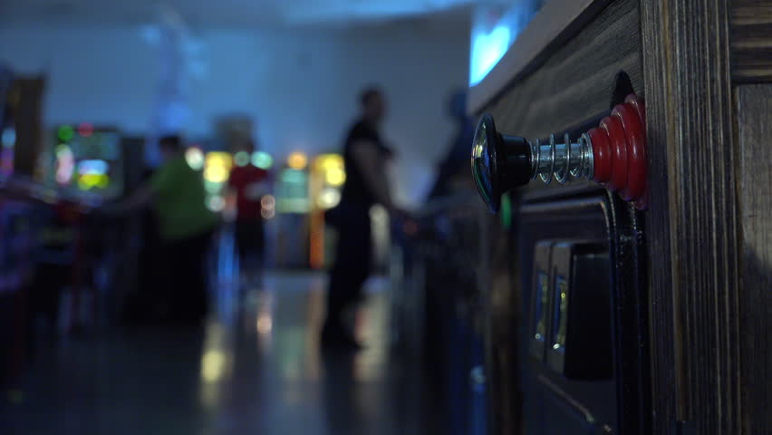 Pinball players at arcade in background of machine 4k | Shutterstock HD Video #16396438