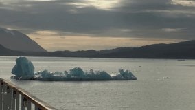 Floating icebergs on mirror surface of ocean in Arctic. Fantastic wonderful amazing video grenland nature iceland and Arctic. Lovely shooting the life of nature, seaside and mountains. Global warming.