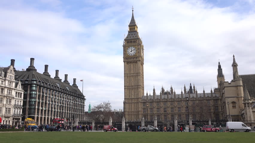 LONDON, ENGLAND - MAR 2016: Big Ben London UK traffic downtown. Capital, most populous city of England, United Kingdom, Europe. World Heritage Sites of historical significance. Busy urban roads. Royalty-Free Stock Footage #16401442